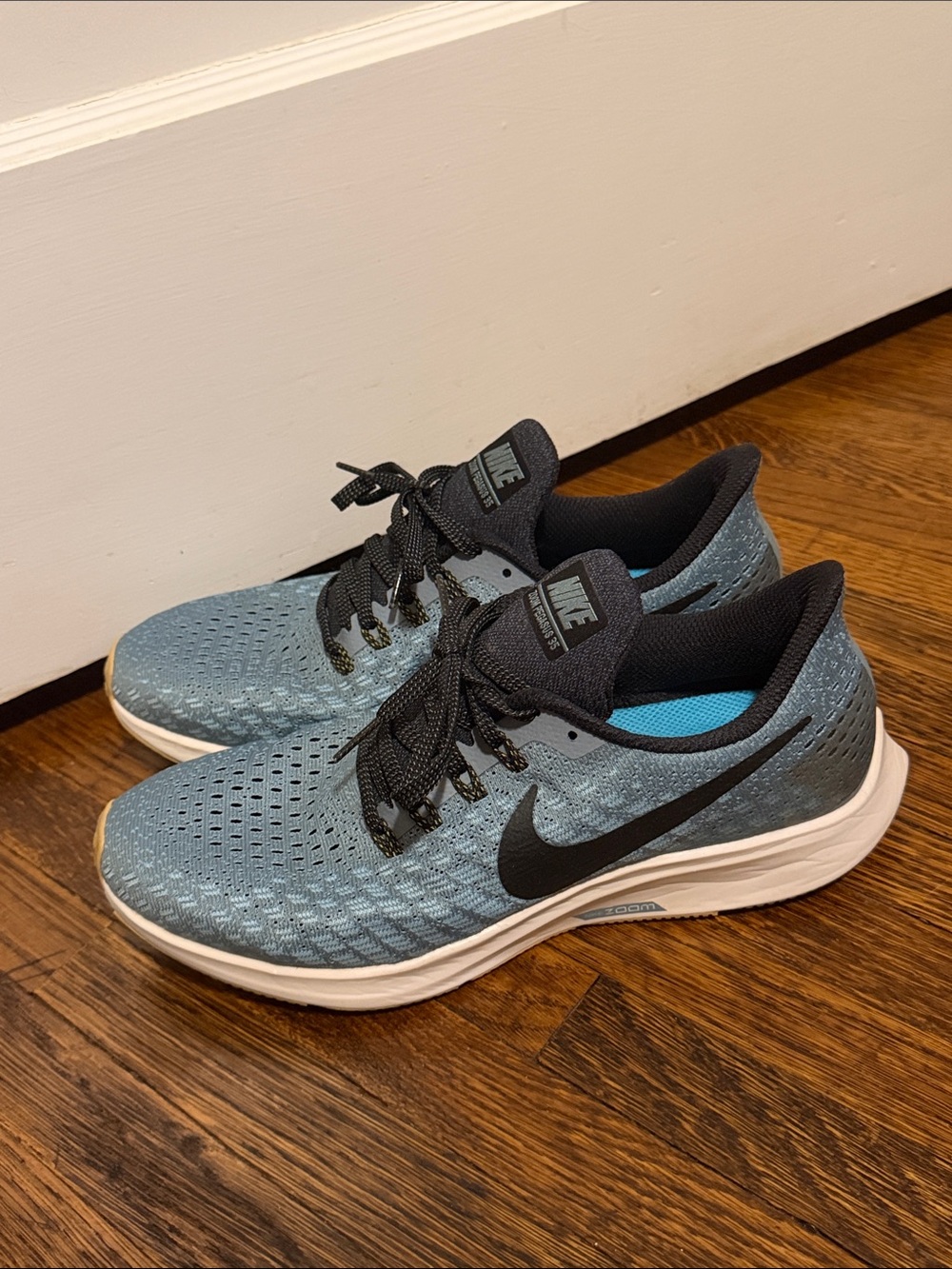 Nike Light Blue Running Shoes with Black Swoosh